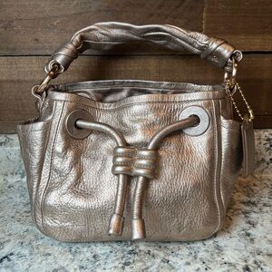Coach Gold pebbled leather handbag w/ adjustable crossbody or shoulder strap
